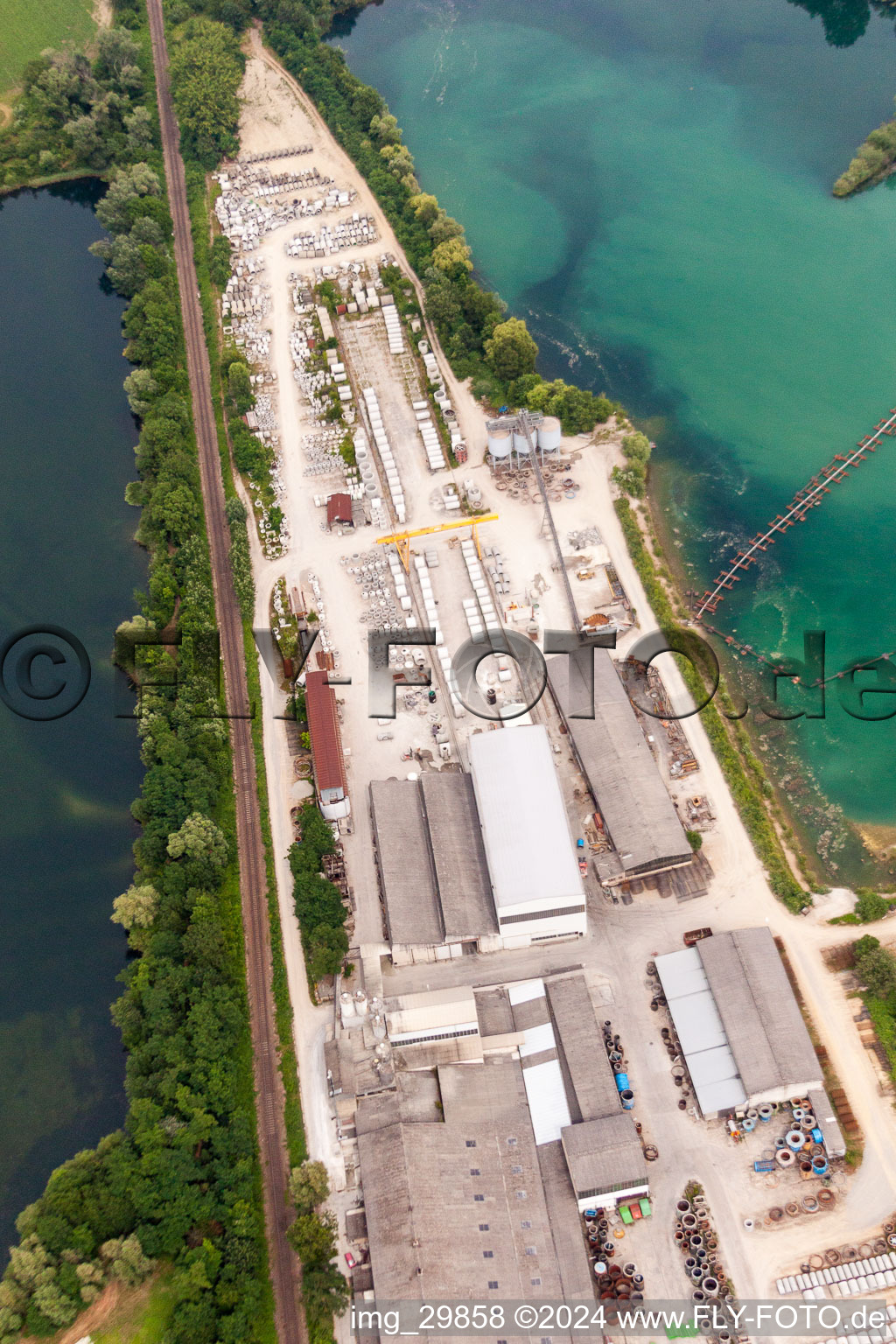 Mixed concrete parts factory at a lake in the district Rheinsheim in Philippsburg in the state Baden-Wurttemberg, Germany