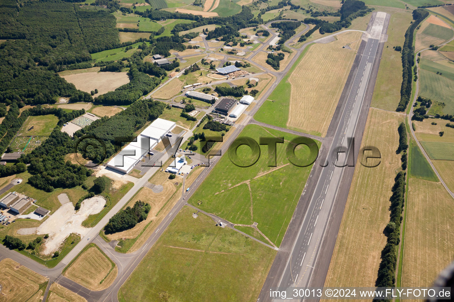 Remains of the abandoned ruins of the hangars and handling facilities at the former airfield Bad Sobernheim in the district Industrie- und Gewerbegebiet Pferdsfeld in Bad Sobernheim in the state Rhineland-Palatinate