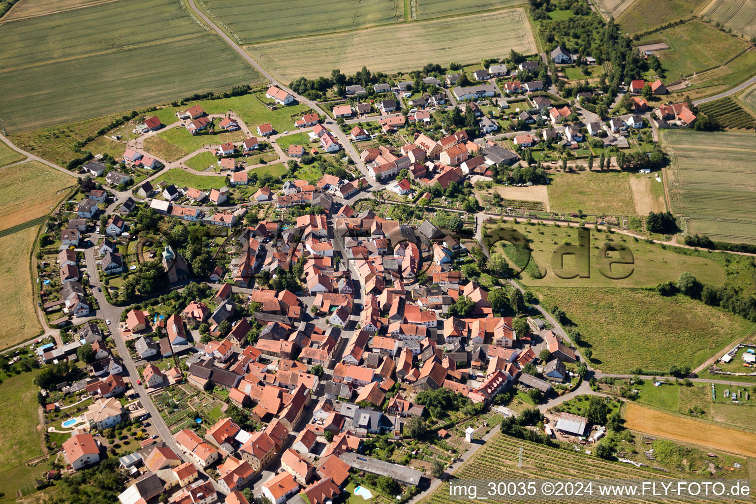 Aerial view of Village - view on the edge of agricultural fields and farmland in the district Neudorferhof in Duchroth in the state Rhineland-Palatinate