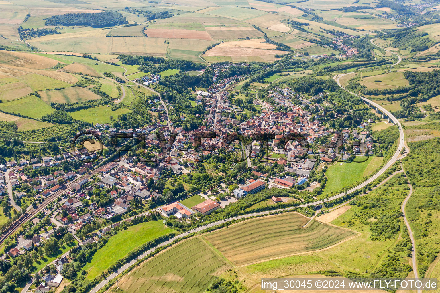 Aerial view of Village - view on the edge of agricultural fields and farmland in Alsenz in the state Rhineland-Palatinate, Germany