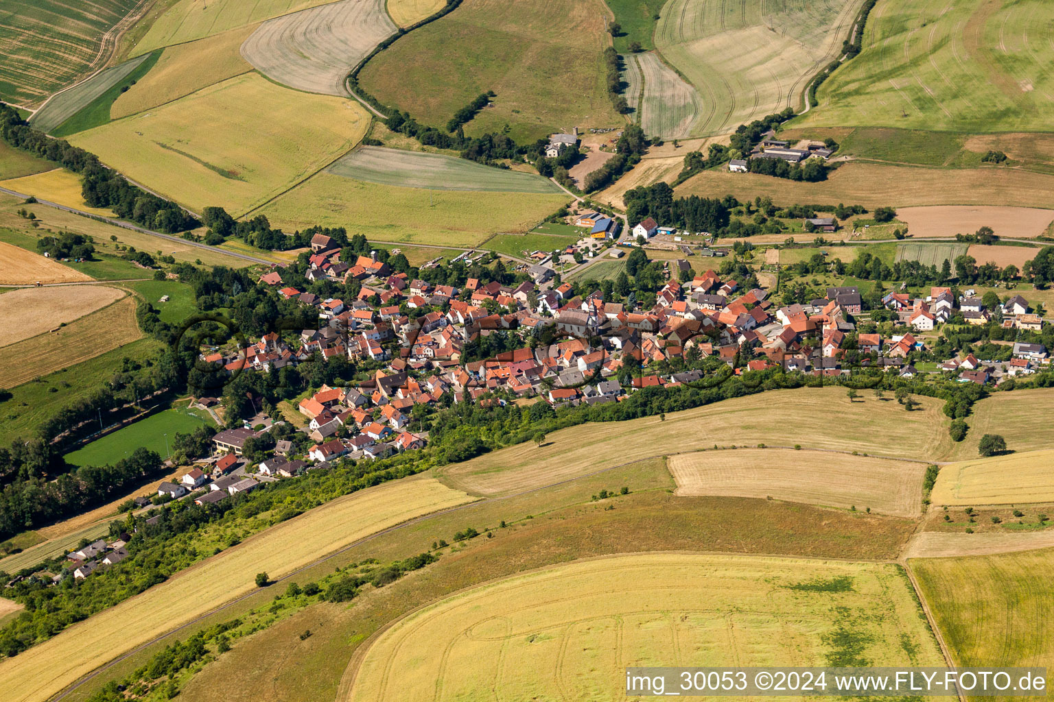 Village - view on the edge of agricultural fields and farmland in Gerbach in the state Rhineland-Palatinate, Germany