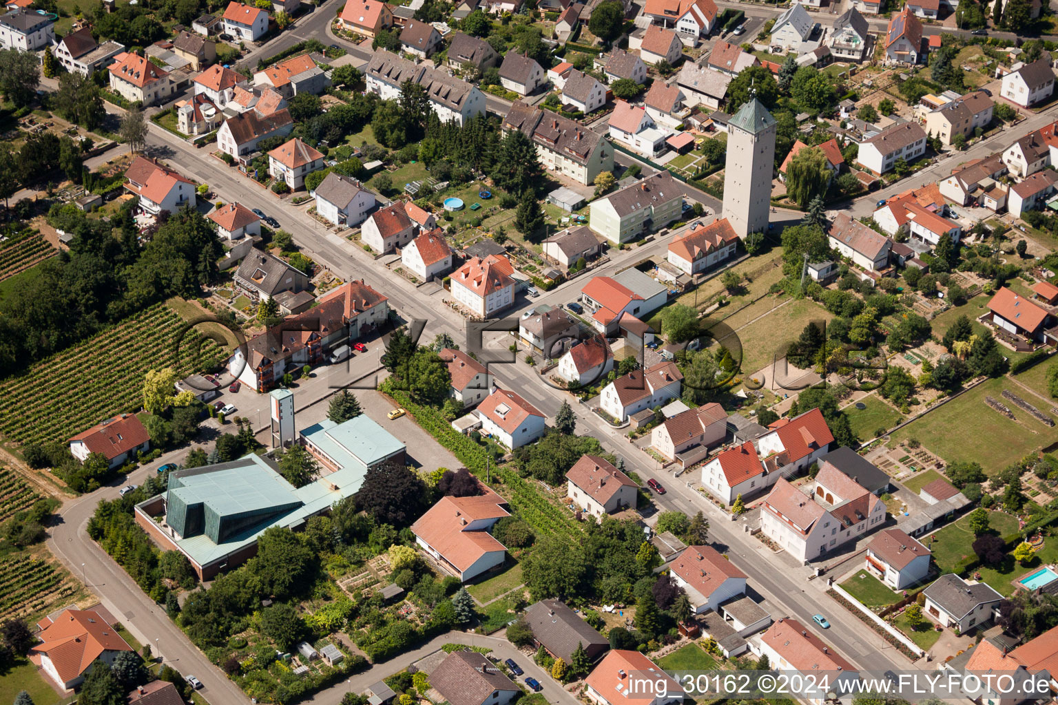 Aerial view of Church tower and tower roof at the church building of Heilig Kreuz in the district Lachen-Speyerdorf in Neustadt an der Weinstrasse in the state Rhineland-Palatinate, Germany