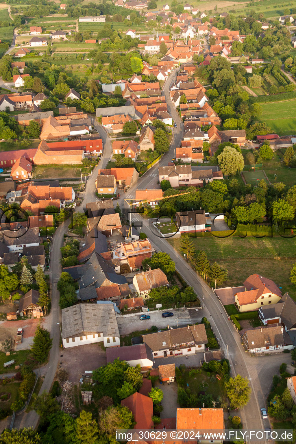 Aerial view of Street - road guidance of Hauptstrasse in Wintzenbach in Grand Est, France