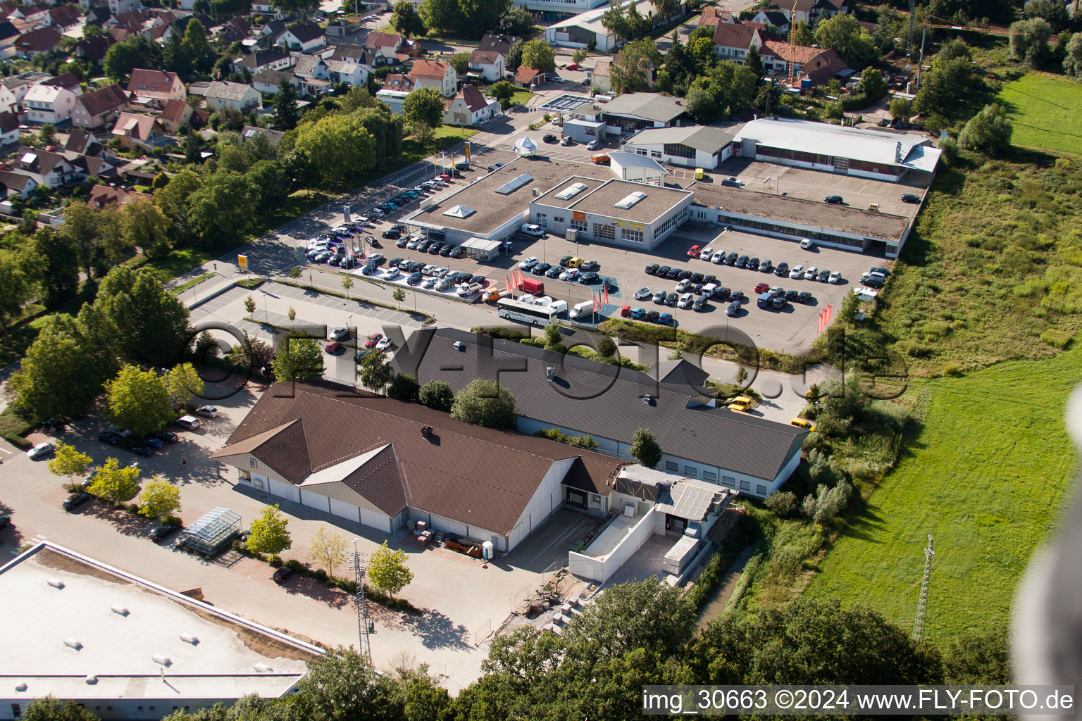 Aerial view of Lauterburgerstraße, Aldi expansion construction site in Kandel in the state Rhineland-Palatinate, Germany