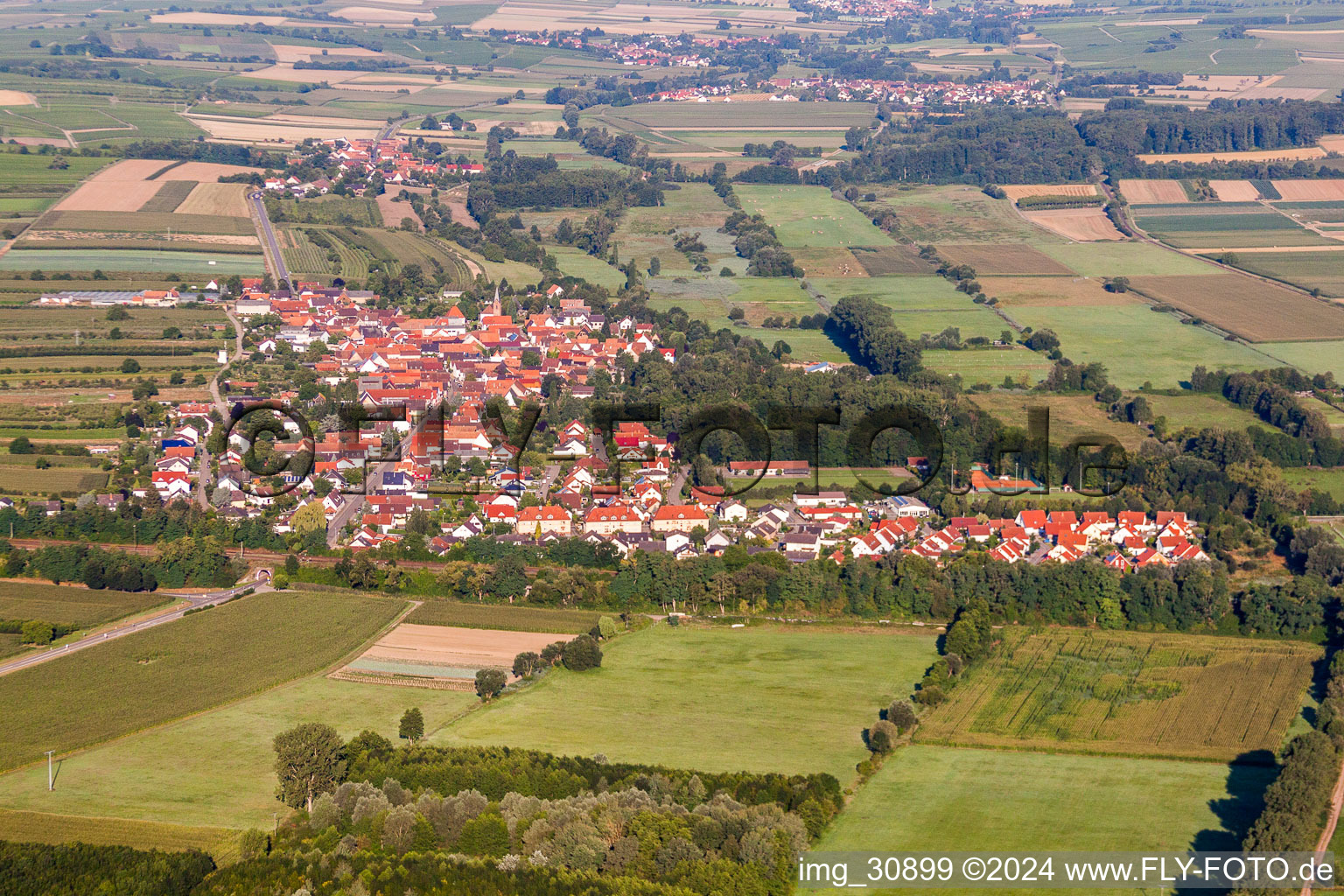 Aerial view of Village - view on the edge of agricultural fields and farmland in Winden in the state Rhineland-Palatinate, Germany