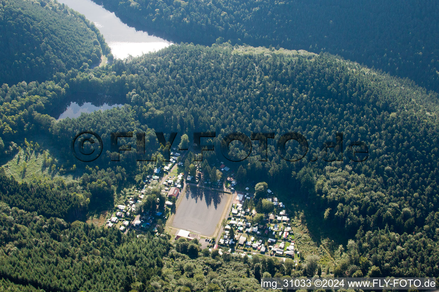 Aerial view of Nature camping “Am Berwartstein” at the Seehofweiher in Erlenbach bei Dahn in the state Rhineland-Palatinate, Germany