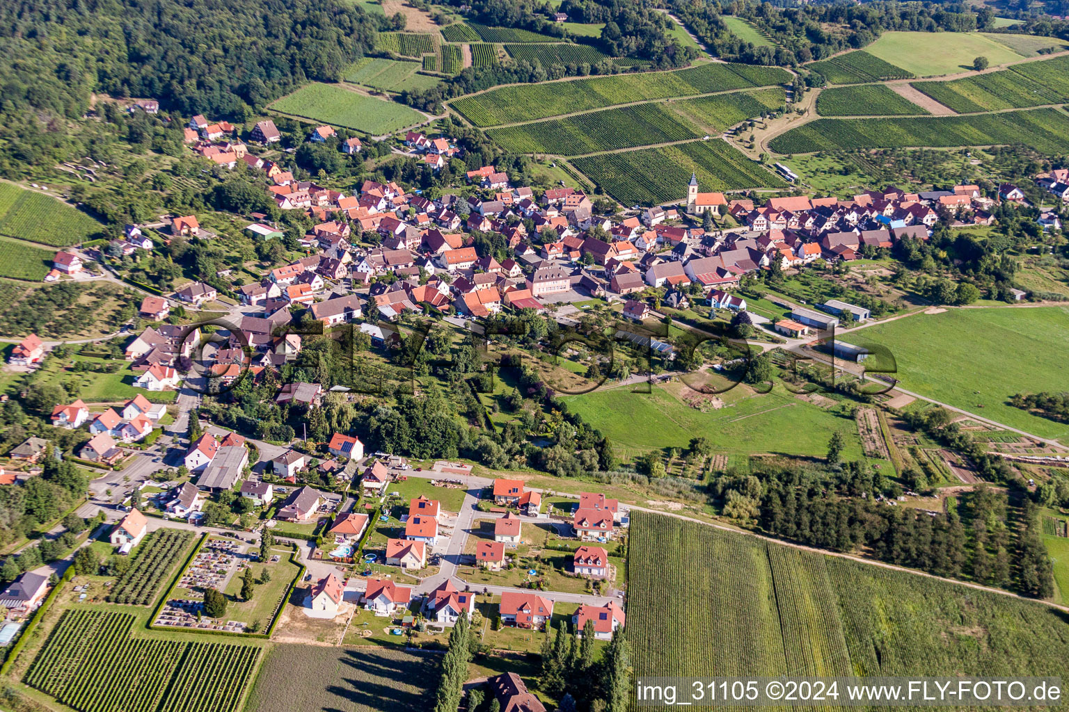 Village - view on the edge of agricultural fields and farmland in Rott in Grand Est, France from above