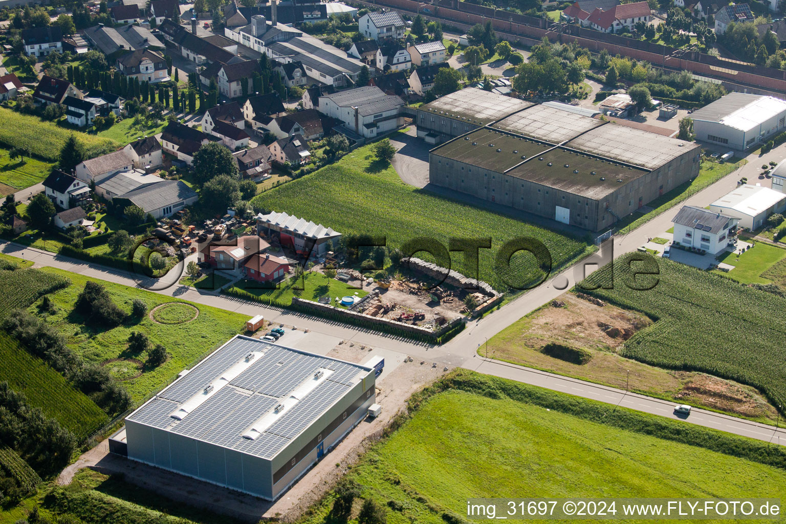 Building and production halls on the premises of Muffenrohr GmbH in Ottersweier in the state Baden-Wurttemberg from above