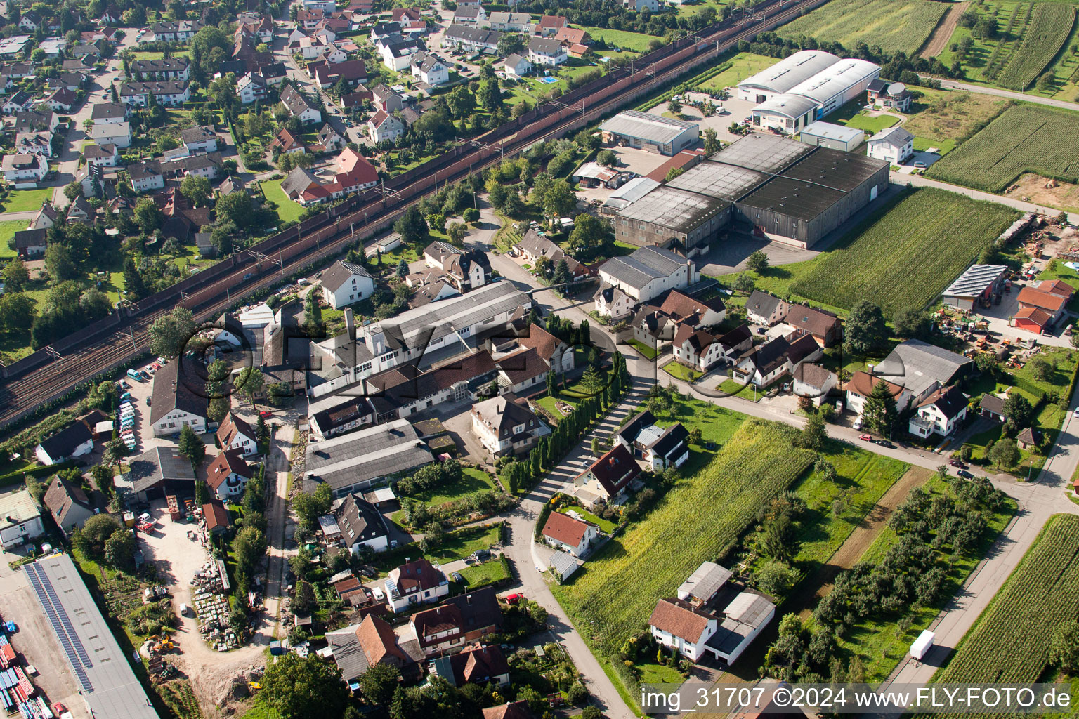 Building and production halls on the premises of Muffenrohr GmbH in Ottersweier in the state Baden-Wurttemberg from a drone