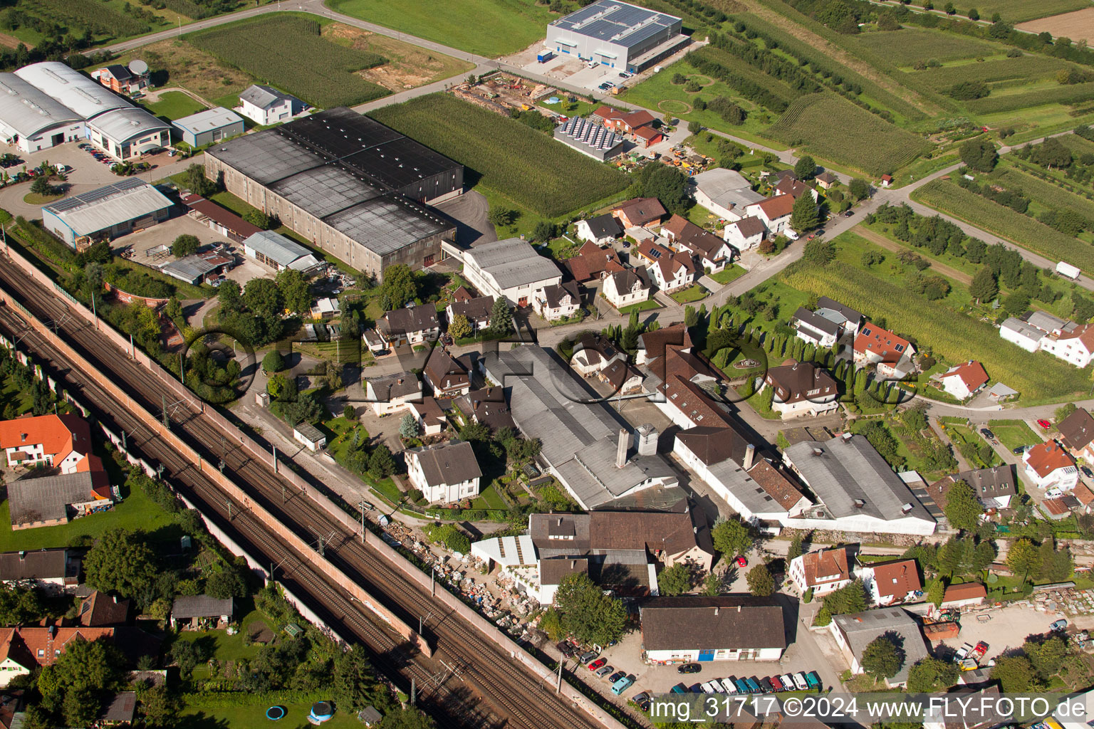 Building and production halls on the premises of Muffenrohr GmbH in Ottersweier in the state Baden-Wurttemberg from above