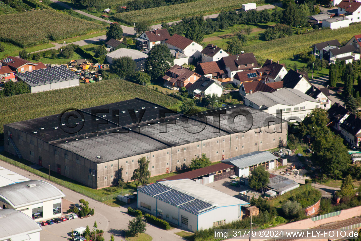 Building and production halls on the premises of Muffenrohr GmbH in Ottersweier in the state Baden-Wurttemberg from above