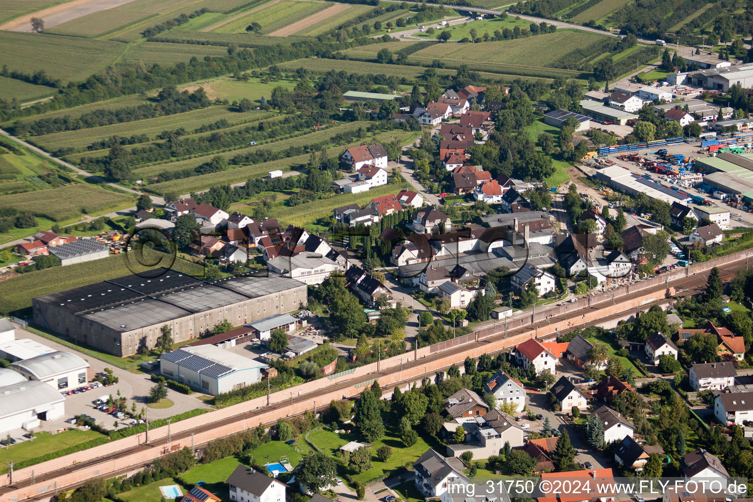 Oblique view of Building and production halls on the premises of Muffenrohr GmbH in Ottersweier in the state Baden-Wurttemberg