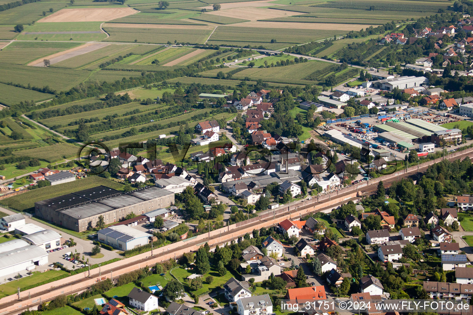 Building and production halls on the premises of Muffenrohr GmbH in Ottersweier in the state Baden-Wurttemberg from above