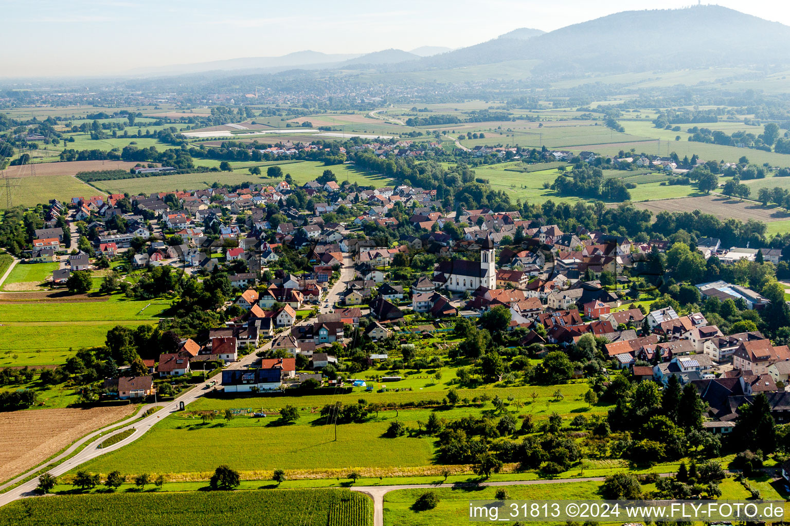 Village - view on the edge of agricultural fields and farmland in Weitenung in the state Baden-Wurttemberg, Germany