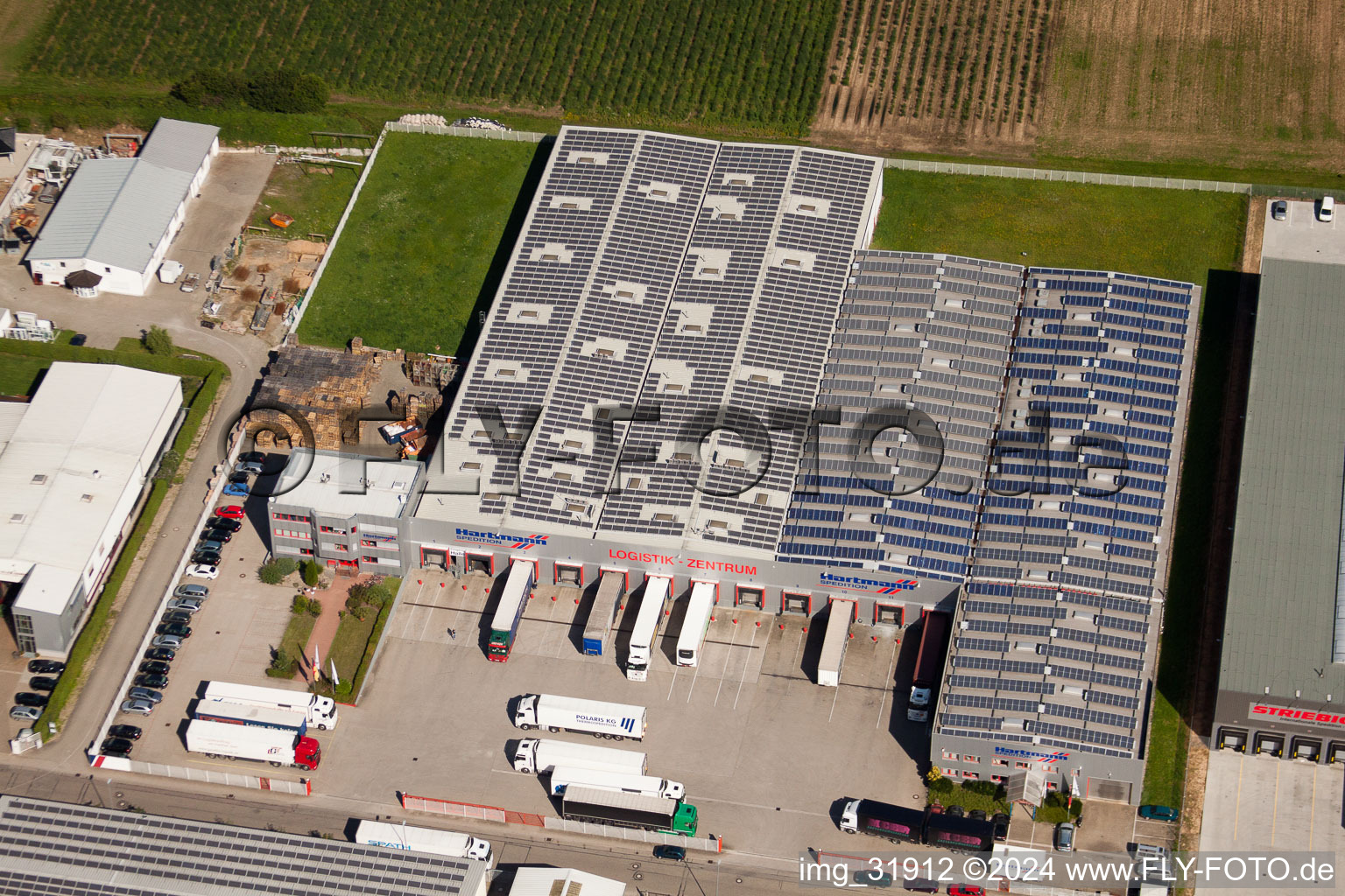 Aerial view of Schleifweg Industrial Area, Hartmann Spedition Logistics Center in Muggensturm in the state Baden-Wuerttemberg, Germany