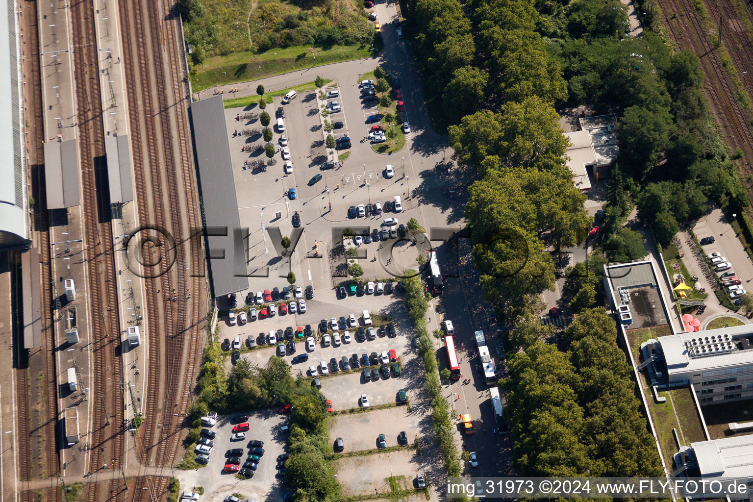 Track progress and building of the main station of the railway in Karlsruhe in the state Baden-Wurttemberg from the plane