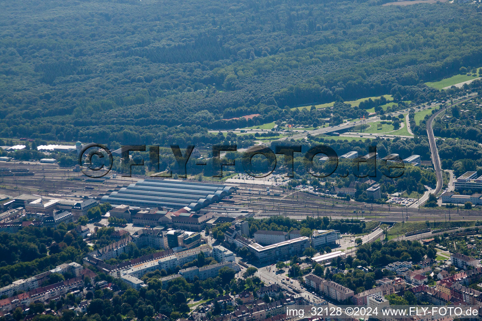 Track progress and building of the main station of the railway in Karlsruhe in the state Baden-Wurttemberg from the plane