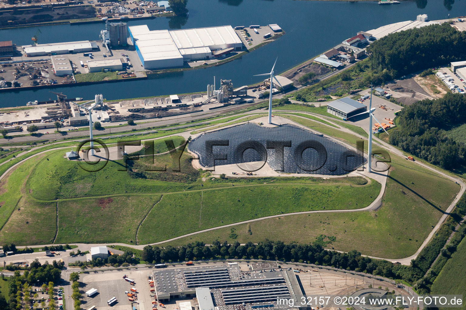 Garbage mountain with wind turbines in the district Rheinhafen in Karlsruhe in the state Baden-Wuerttemberg, Germany