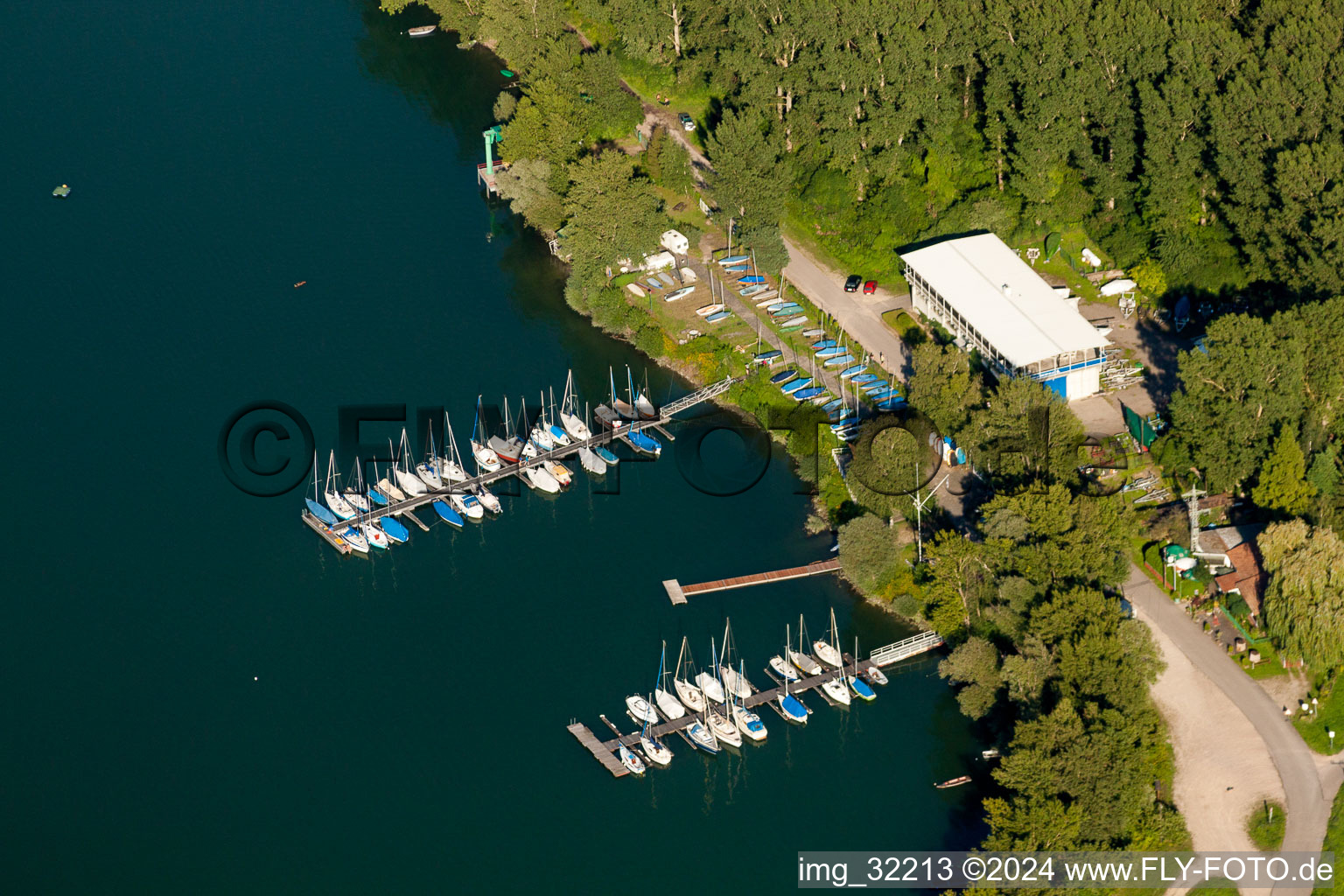 Aerial view of Pleasure boat marina with docks and moorings on the shore area of Segelclub RKC Woerth e.V. in Woerth am Rhein in the state Rhineland-Palatinate, Germany