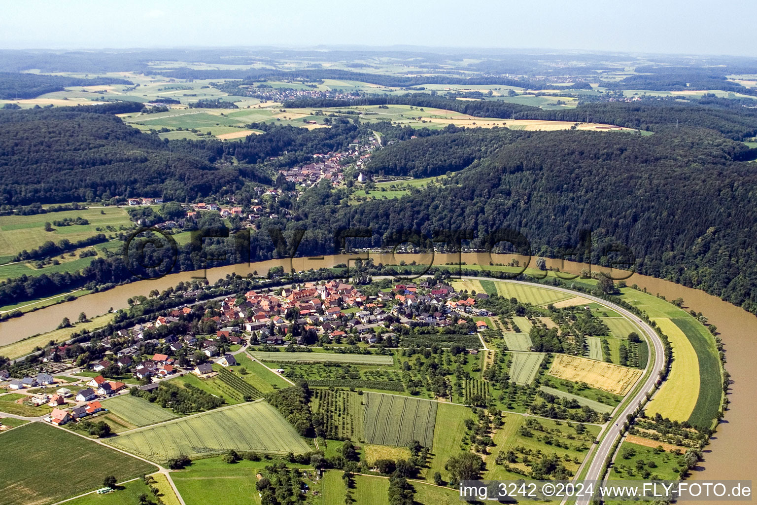 Village on the river bank areas Neckar in the district Moertelstein in Binau in the state Baden-Wurttemberg