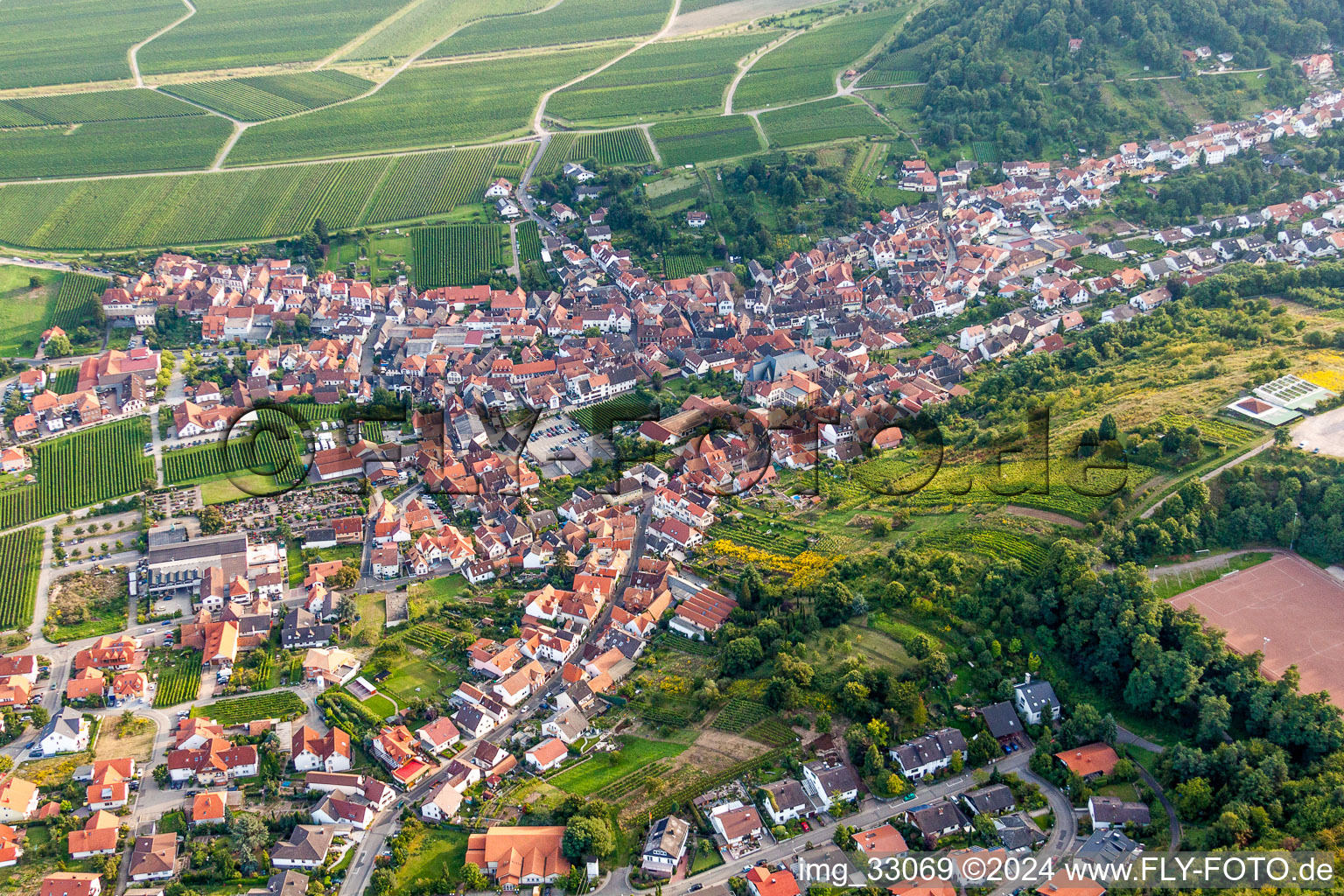 Oblique view of Village - view on the edge of agricultural fields and farmland in Sankt Martin in the state Rhineland-Palatinate, Germany