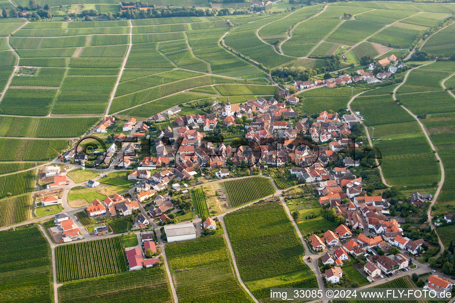 Aerial view of Village - view on the edge of agricultural fields and farmland in Weyher in der Pfalz in the state Rhineland-Palatinate, Germany