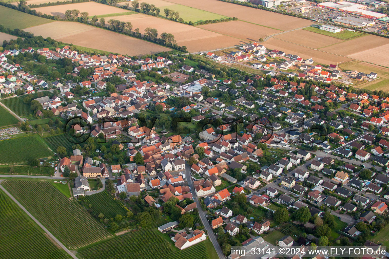 Village - view on the edge of agricultural fields and farmland in Bornheim in the state Rhineland-Palatinate