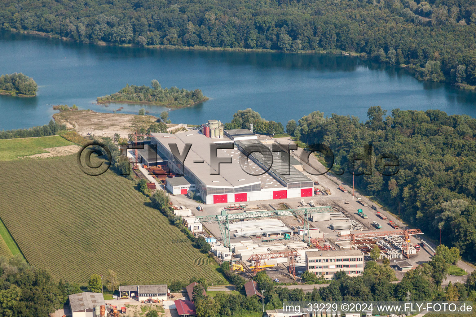 Aerial view of Mixed concrete and building materials factory of Betonfertigteilewerk Linkenheim GmbH & Co. KG in Linkenheim-Hochstetten in the state Baden-Wurttemberg, Germany