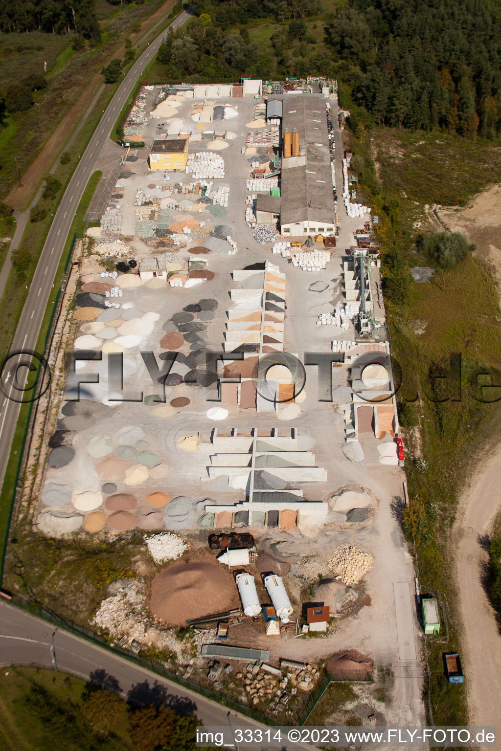 Garden gravel company, Badische Terrazzo Handelsgesellschaft mbH Huttenheimer Landstrasse 2-6 in the district Neudorf in Graben-Neudorf in the state Baden-Wuerttemberg, Germany viewn from the air