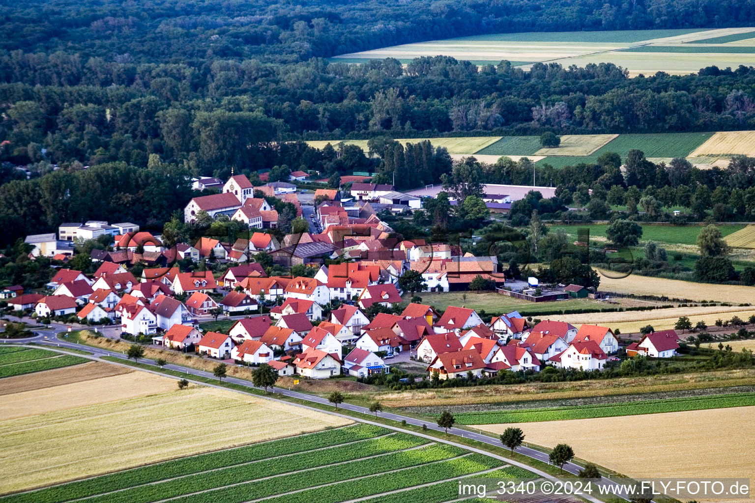 Oblique view of Village - view on the edge of agricultural fields and farmland in Kuhardt in the state Rhineland-Palatinate