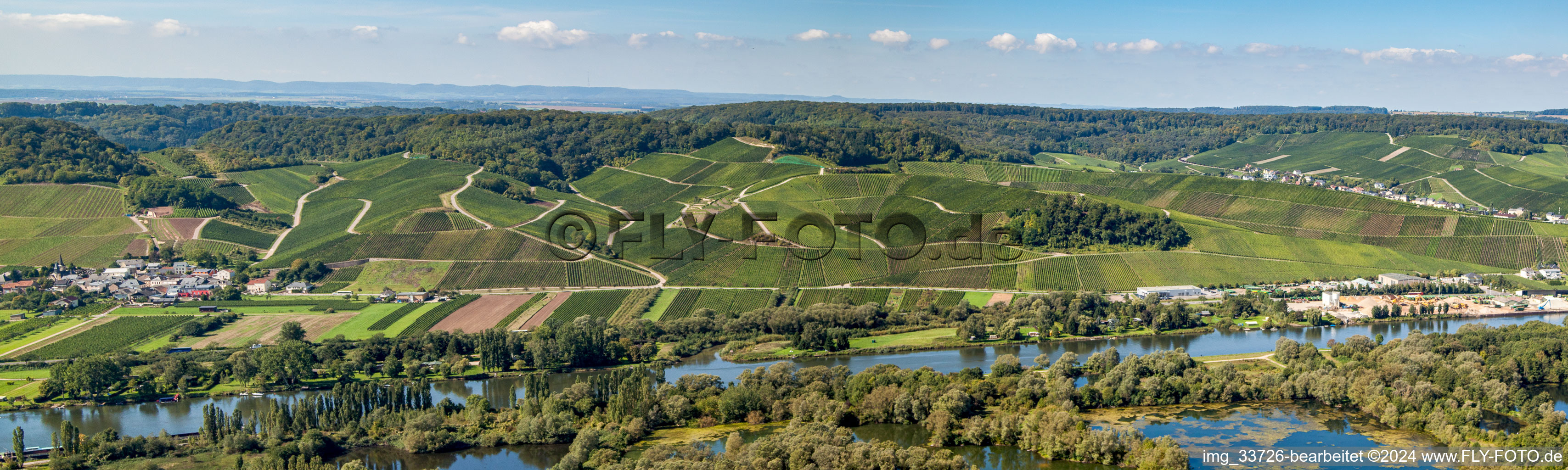 Panoramic perspective of Riparian zones on the course of the river Mosel below Wineyards in Wellesteen in Distrikt Greiwemaacher, Luxembourg