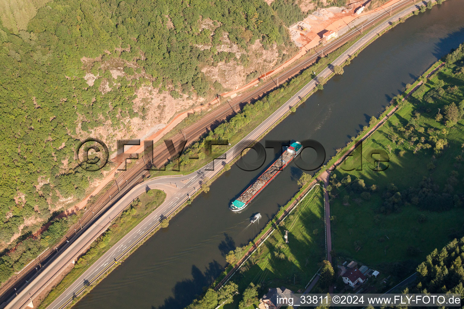 Cargo ship with scrap on the Saar in Taben-Rodt in the state Rhineland-Palatinate, Germany