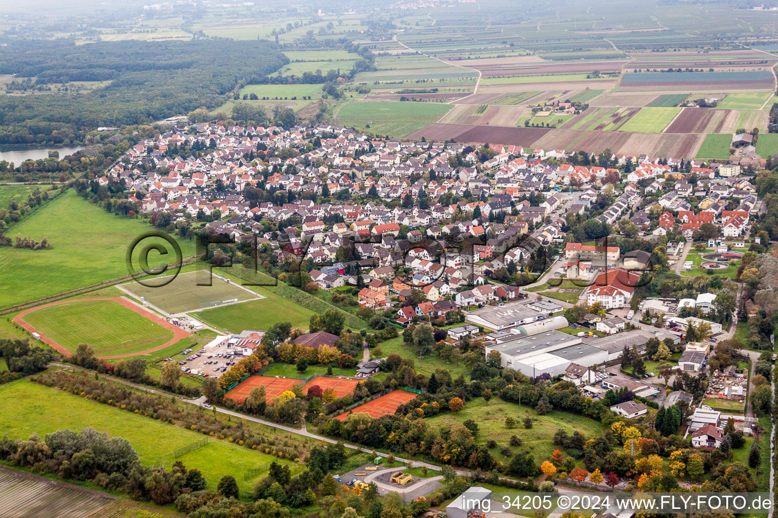 Village - view on the edge of agricultural fields and farmland in Lambsheim in the state Rhineland-Palatinate, Germany