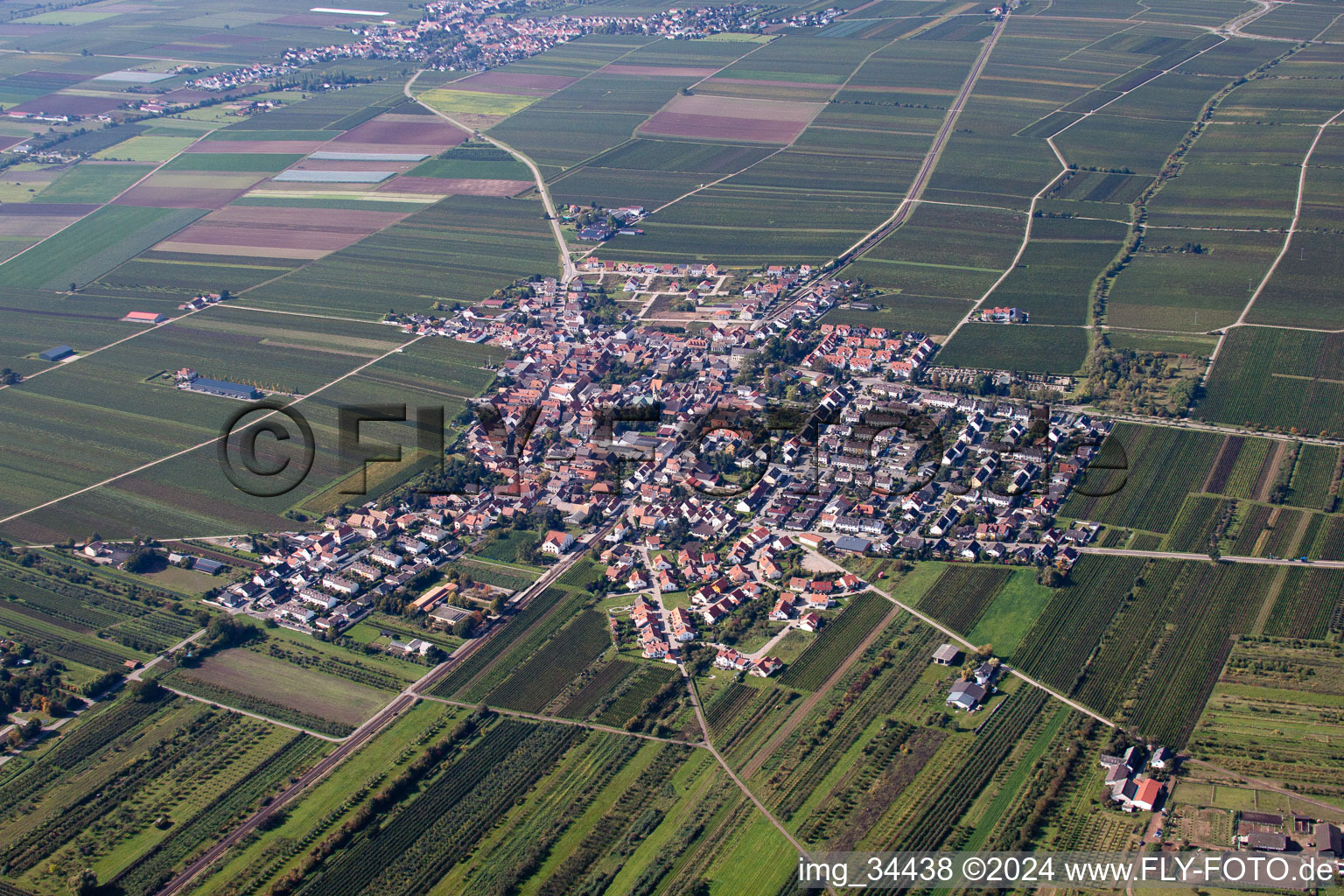 Aerial view of Village - view on the edge of agricultural fields and farmland in Fussgoenheim in the state Rhineland-Palatinate, Germany