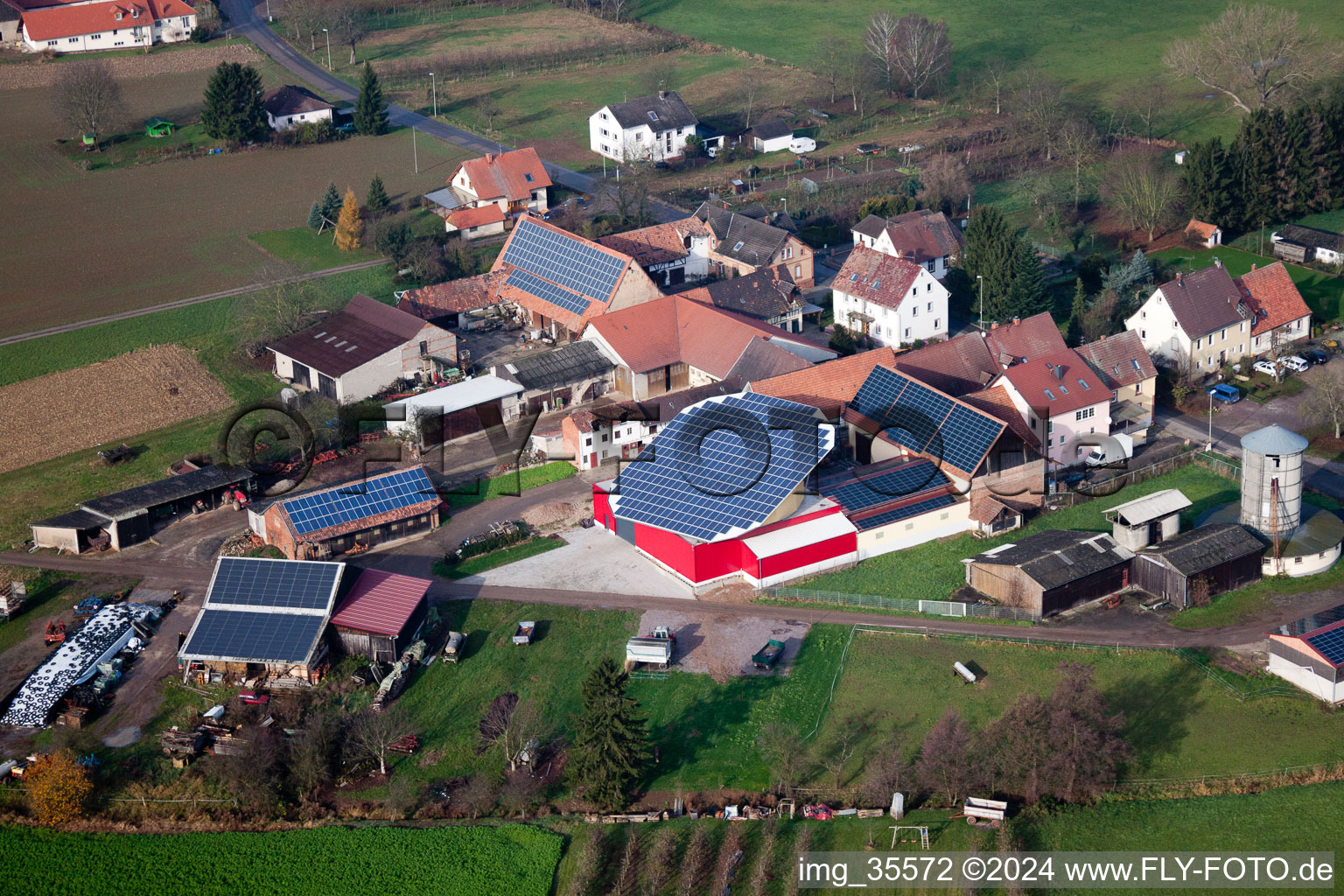 Aerial view of Panel rows of photovoltaic turnable roof of a stable in the district Deutschhof in Kapellen-Drusweiler in the state Rhineland-Palatinate