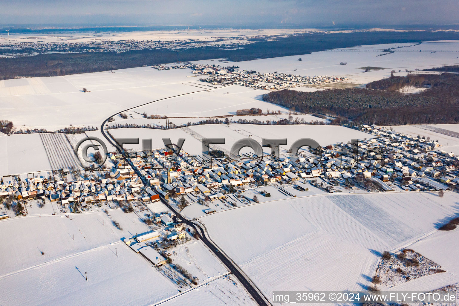 Aerial view of From the southwest in winter when there is snow in Erlenbach bei Kandel in the state Rhineland-Palatinate, Germany