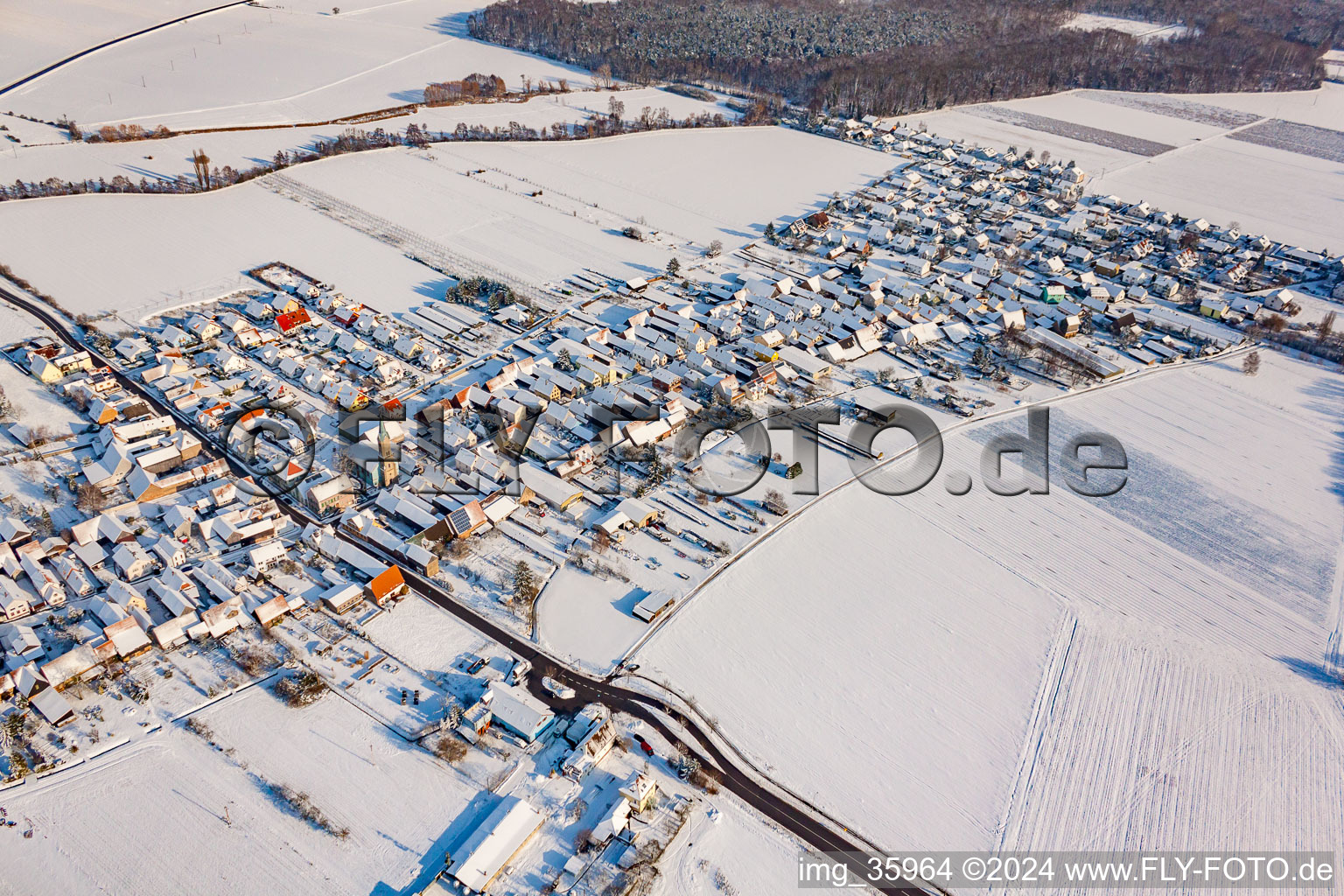 Aerial photograpy of From the southwest in winter when there is snow in Erlenbach bei Kandel in the state Rhineland-Palatinate, Germany