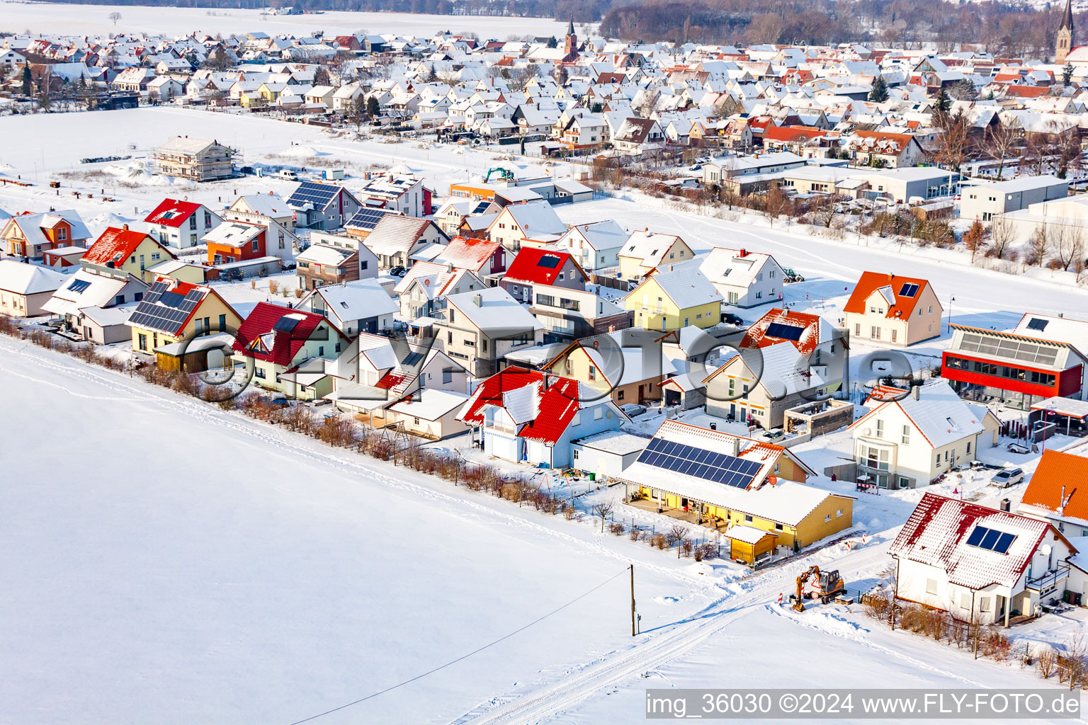 Aerial view of New development area Brotäcker in winter with snow in Steinweiler in the state Rhineland-Palatinate, Germany