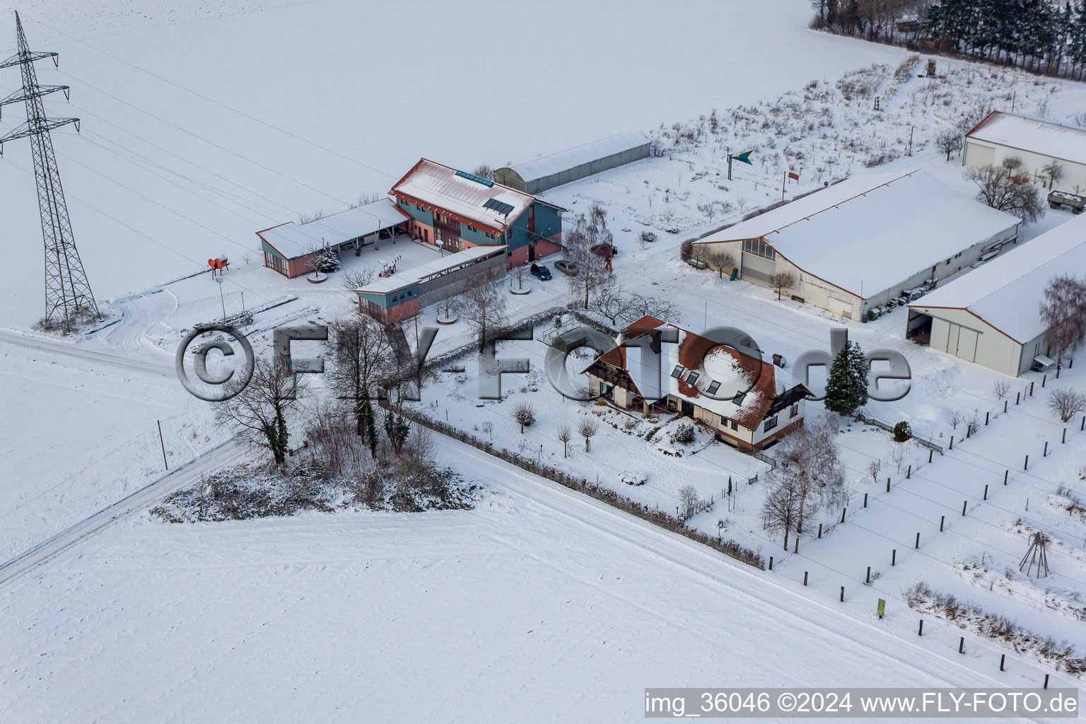 Schoßberghof in Minfeld in the state Rhineland-Palatinate, Germany seen from a drone