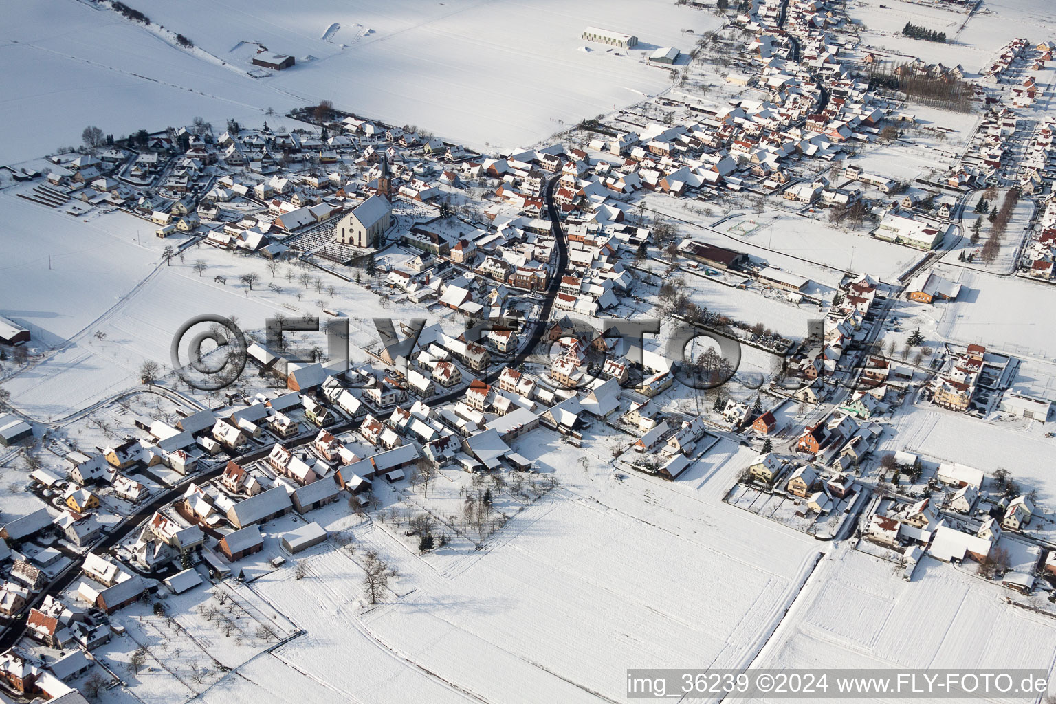 Wintry snowy Church building in the village of in Schleithal in Grand Est, France