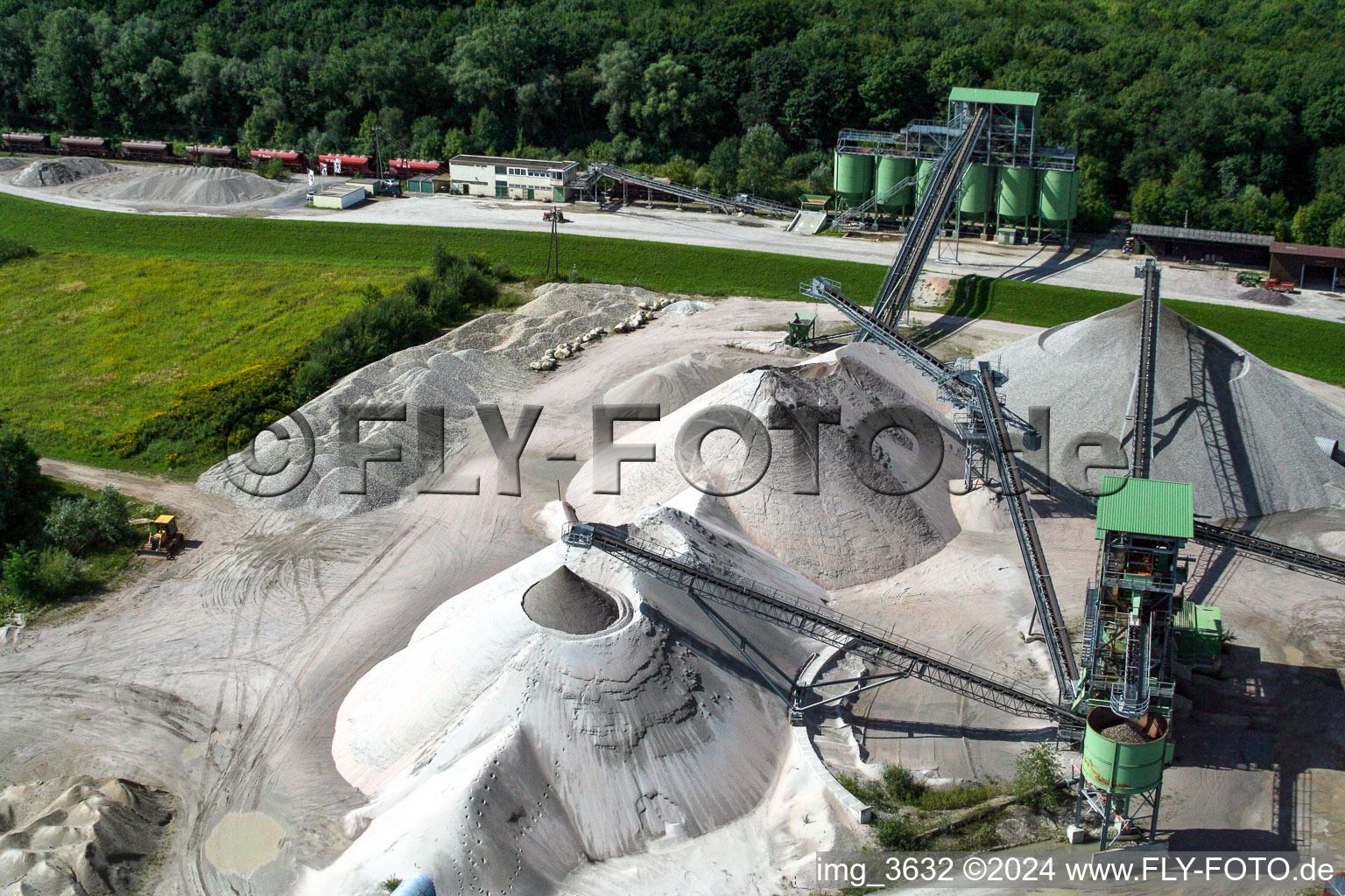 Piles of sand and gravel on site of the gravel mining WOLFF & MUeLLER Baustoffe in Hagenbach in the state Rhineland-Palatinate