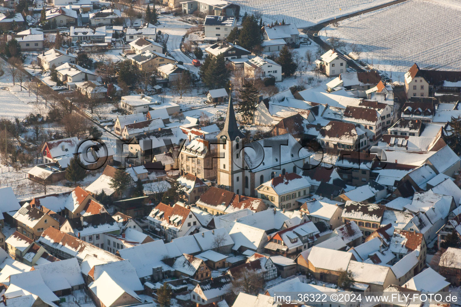 Wintry snowy Church building in of Evangelischen Kirche Old Town- center of downtown in the district Moerzheim in Landau in der Pfalz in the state Rhineland-Palatinate, Germany