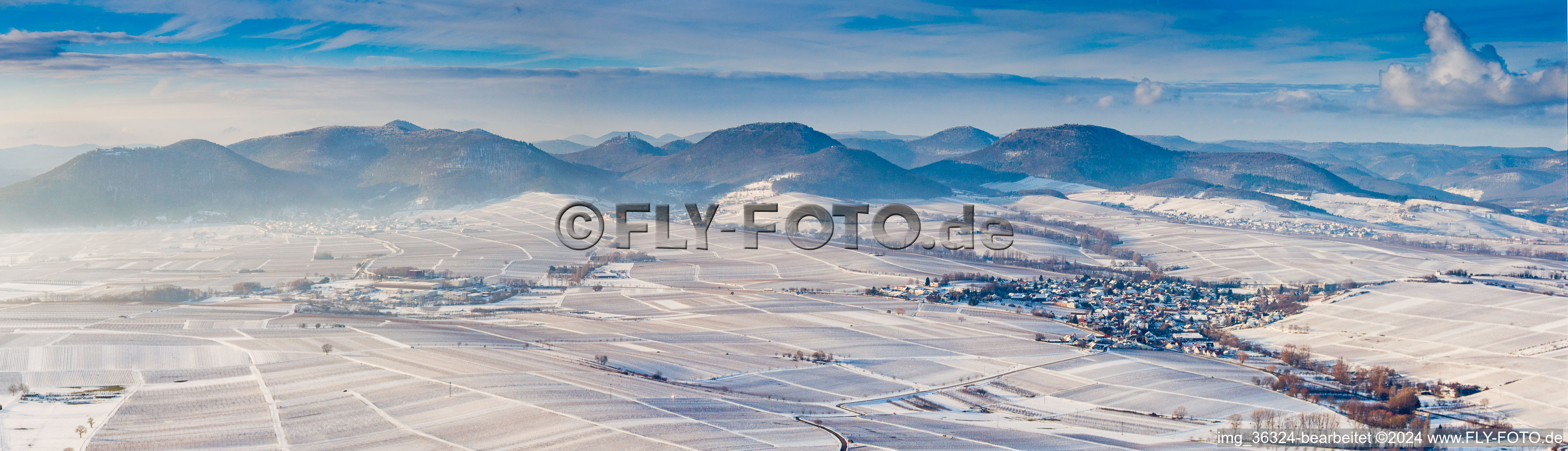 Wintry snowy Forest and mountain scenery of Haardtrand of Pfaelzerwald in Ilbesheim bei Landau in der Pfalz in the state Rhineland-Palatinate, Germany