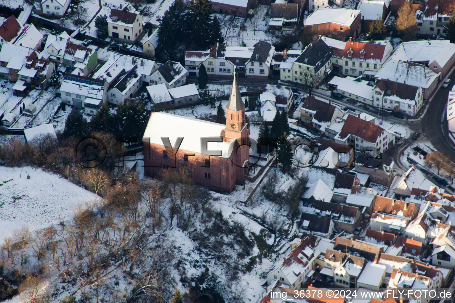 Winterly Town View of the streets and houses of the residential areas in Albersweiler in the state Rhineland-Palatinate from above