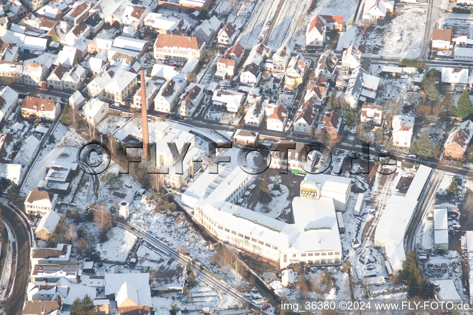 Winterly Town View of the streets and houses of the residential areas in Albersweiler in the state Rhineland-Palatinate out of the air
