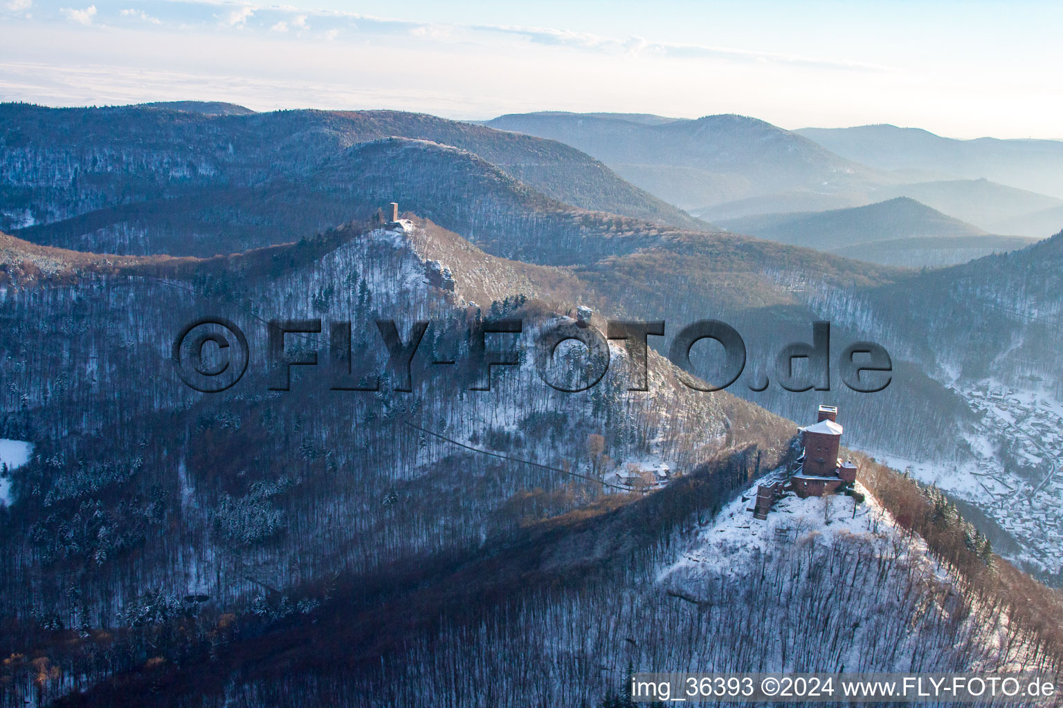 The 4 castles Trifels, Anebos, Jungturm and Münz in the snow in Annweiler am Trifels in the state Rhineland-Palatinate, Germany