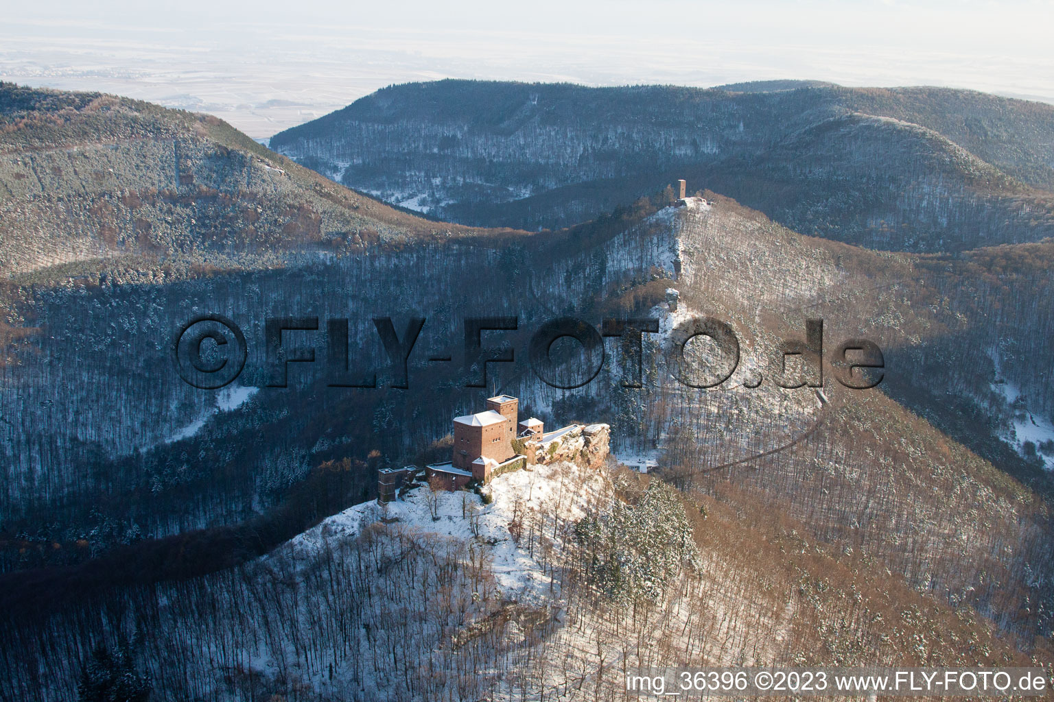 Aerial view of The 4 castles Trifels, Anebos, Jungturm and Münz in the snow in Annweiler am Trifels in the state Rhineland-Palatinate, Germany