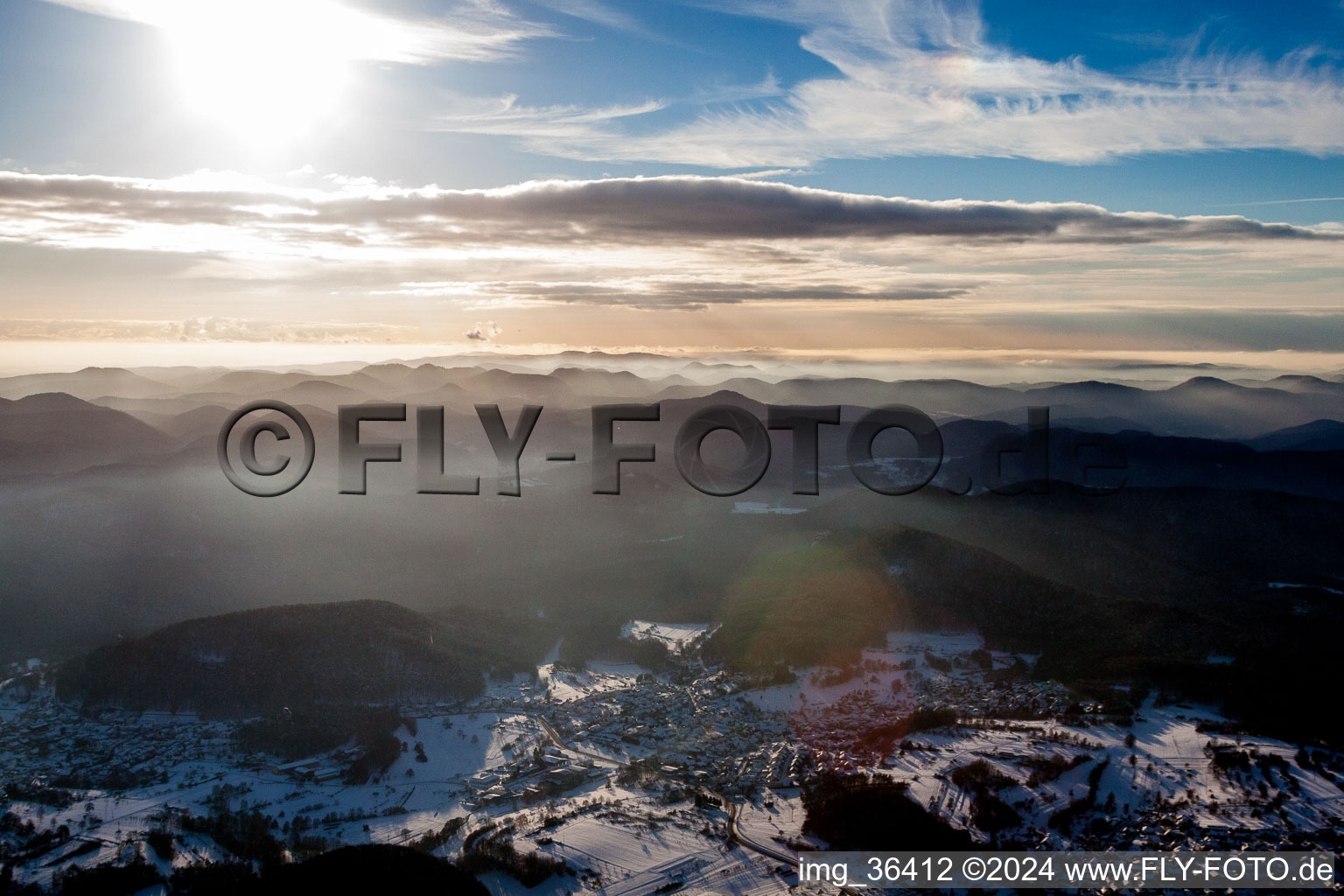 Wintry snowy Forest and mountain scenery of Pfaelzerwald in Gossersweiler-Stein in the state Rhineland-Palatinate, Germany