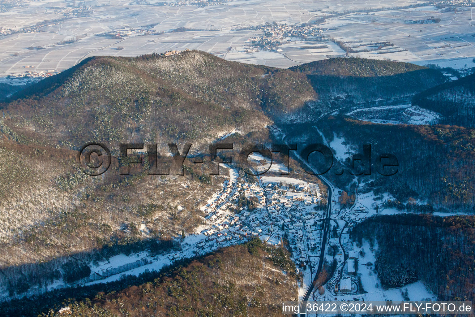 Wintry snowy Village view and und Madenburg in Waldhambach in the state Rhineland-Palatinate, Germany