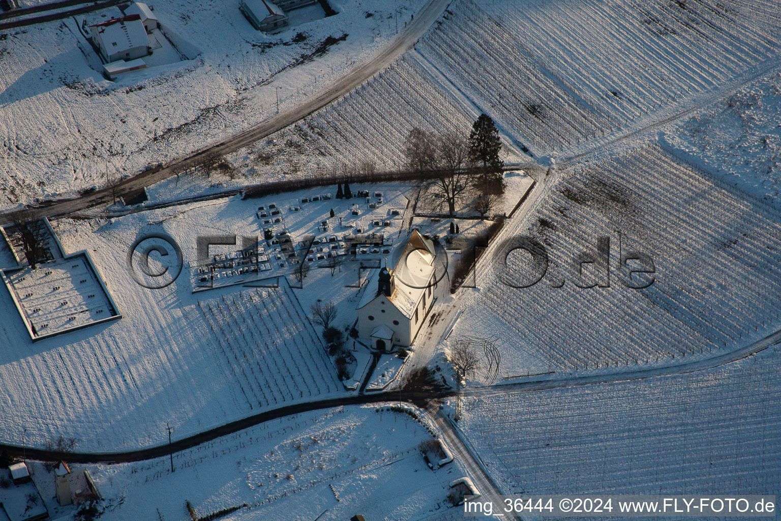 Wintry snowy Churches building the chapel Dyonisos in Gleiszellen-Gleishorbach in the state Rhineland-Palatinate, Germany